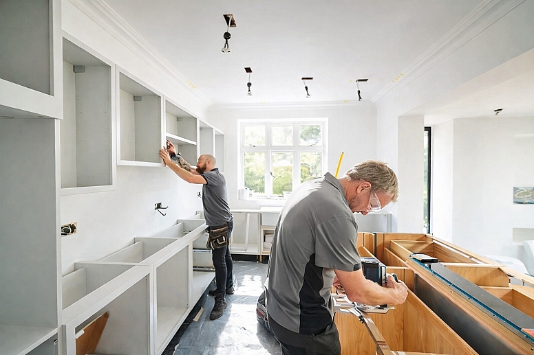 installing kitchen cabinets in progress